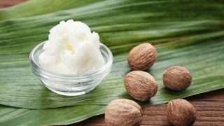 A small bowl containing shea butter kept on