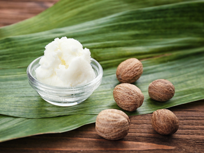 A small bowl containing shea butter kept on