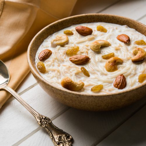 Sheer khurma or cooked vermicelli filled in a bowl with dry fruit toppings