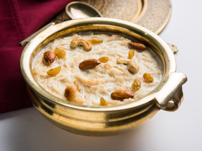 Sheer khurma in a bowl with dry fruit toppings