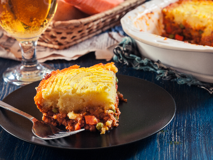 Portion of shepherd's pie or cottage pie on a plate. British cuisine.