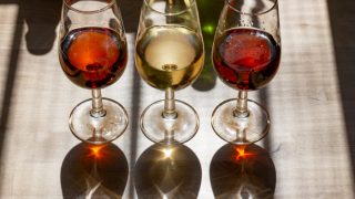 Sherry in different wine glasses on a counter