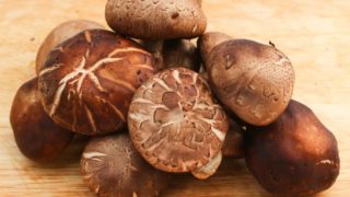 Close-up of shitake mushrooms on a wooden table