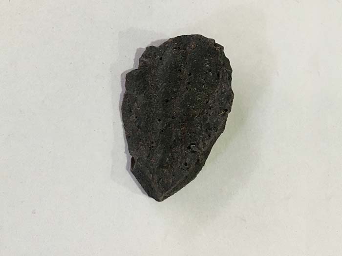 A shilajit rock on a marble background
