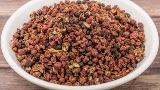 Sichuan pepper seeds in a white bowl