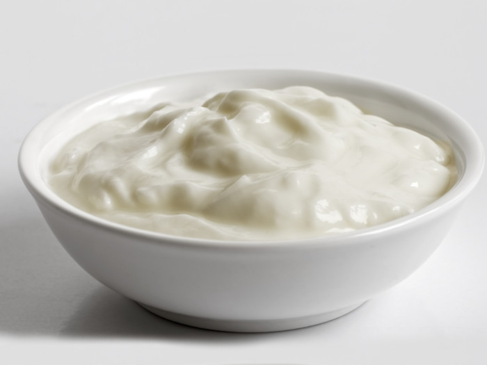Skyr, an Icelandic dairy product, in a white bowl against a white background