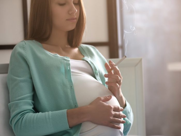 A pregnant woman smoking