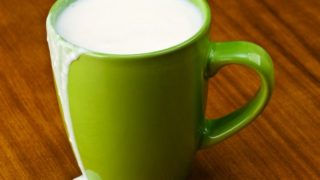 Sour milk in a parrot green mug