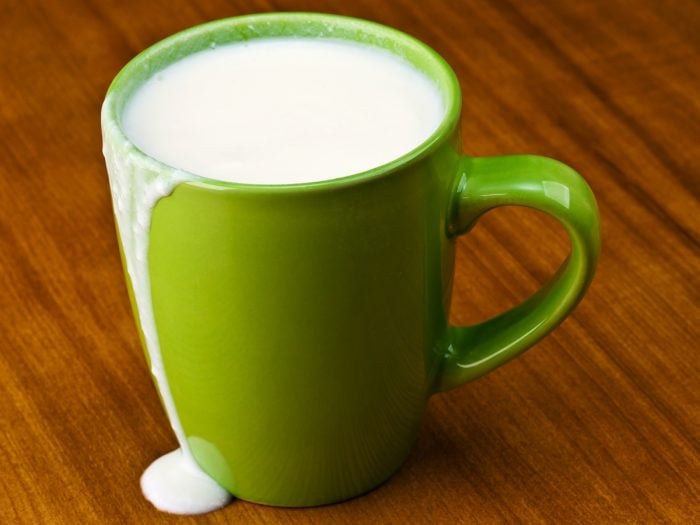 Sour milk in a parrot green mug