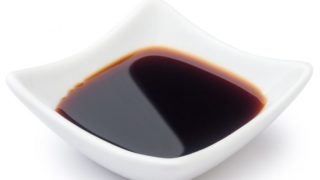A close-up image of soy sauce in a bowl