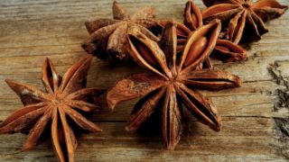 Star anise pods on a wooden table