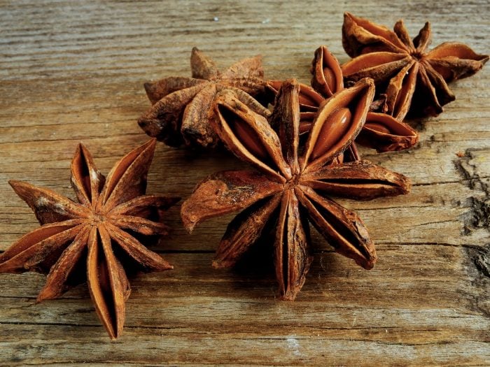 Star anise pods on a wooden table