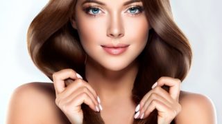 A woman model with long shiny, lustrous brown hair