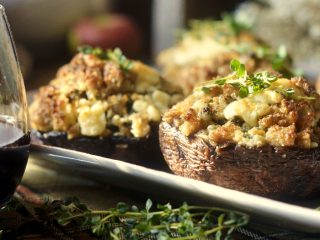 stuffedmushrooms Stuffed mushrooms with Italian sausage, breadcrumbs, fresh sage, thyme, and melted blue cheese; with a glass of red wine