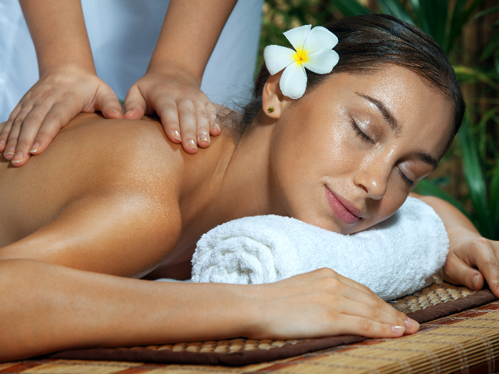 Portrait of a young woman in spa undergoing Swedish massage