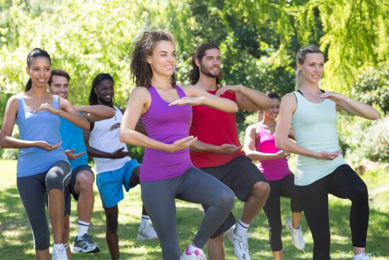 Group of people exercising in a park