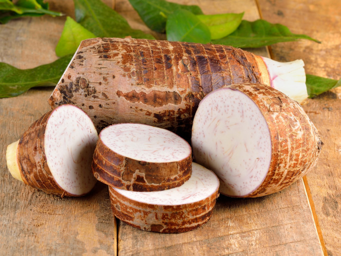 Sliced taro root on a wooden table