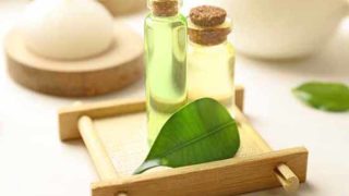 Tea tree oil bottles kept atop a wooden tray
