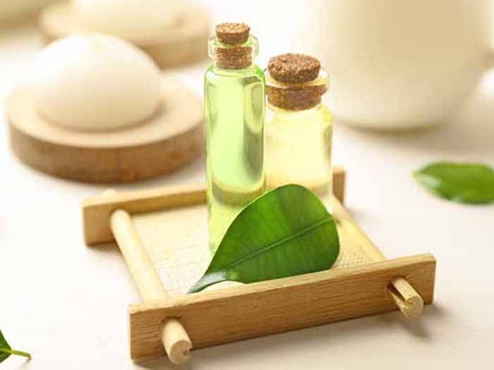 Tea tree oil bottles kept atop a wooden tray