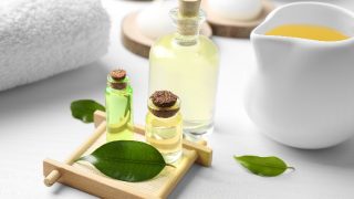 Spa composition with tea tree oil on white background