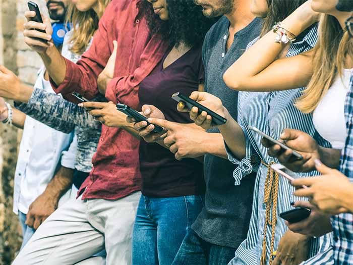 Teenagers and young people using cellphones