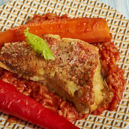 Senagal traditional dish, Thieboudienne or chebu jen, made from fish, rice and tomato sauce