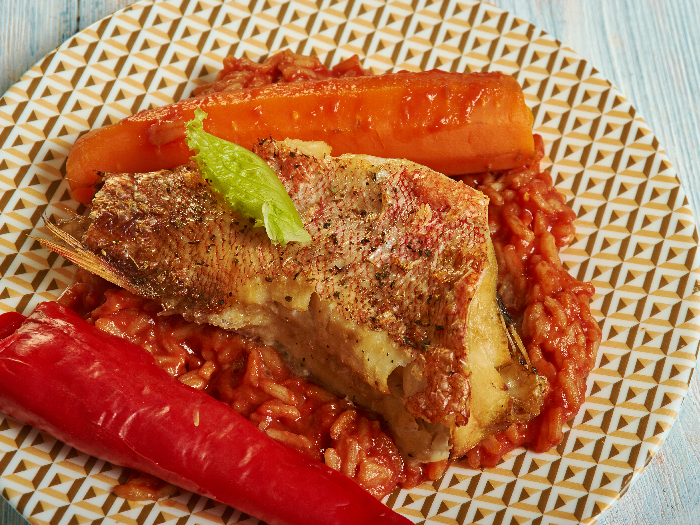 Senagal traditional dish, Thieboudienne or chebu jen, made from fish, rice and tomato sauce