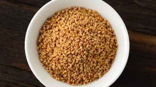 A flat lay pic of toasted sesame seeds in a bowl