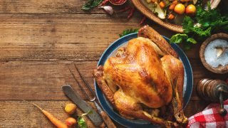 Roasted chicken on rustic wooden table