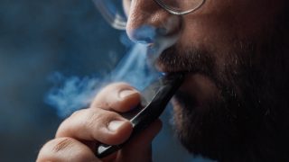 Man using a vaping device