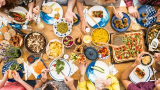 Group of people eating healthy food top view