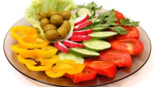 Plate of vegetables on a white background
