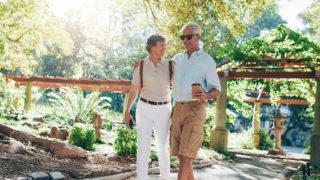 A middle-aged couple walking in the park