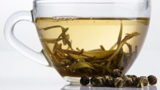 A closeup shot of white tea in a cup