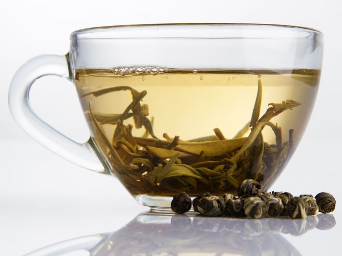 A closeup shot of white tea in a cup