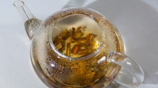 Close up of a teapot with tea made of willow bark