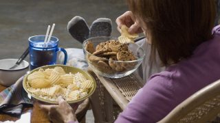 Woman trying to avoid eating junk food