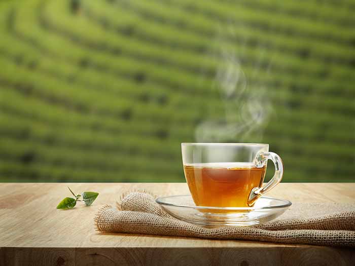 A cup of hot tea on a wooden table